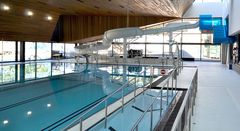 Indoor lap pool and water slide at the Regent Park Aquatic Centre